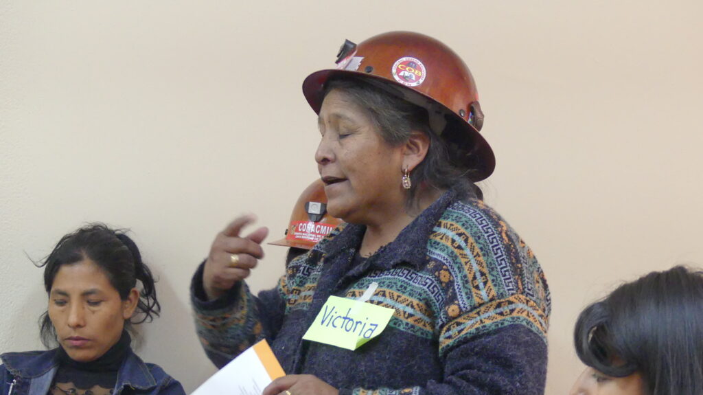 Women miners get candidate commitments to access health insurance and fight violence